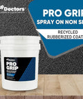 Heavy Duty Rubberized Non Slip Spray Coating Delivers Rock Solid Grip For Wet Patios Decks And Pool Areas Providing Durable Anti Skid Layer For Concrete Wood And Fiberglass Surfaces Game Ready in a white bucket on wood surface.