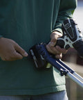 Person holding a Drill Powered Cultivator Attachment For Cordless Drills, Flexible Width Up To 8 Inches, Model 46007