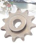 Close-up of 420 11-Tooth Motor Sprocket with Keyway, steel component, suitable for MY1020, MY1016Z, MY1018 motors, with cyclists in background.