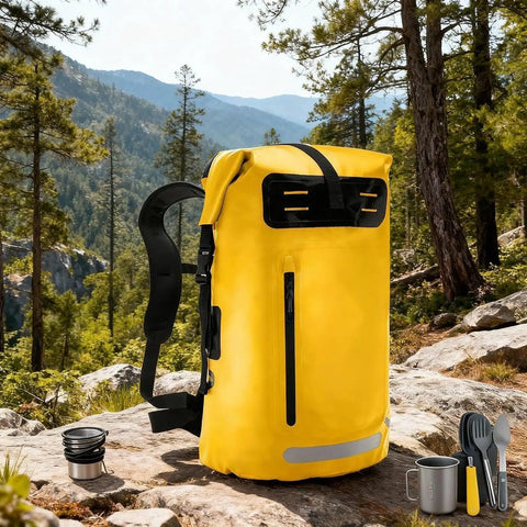Yellow waterproof hiking backpack with PVC construction, large capacity daypack for outdoor adventures, rucksack style on rocks.