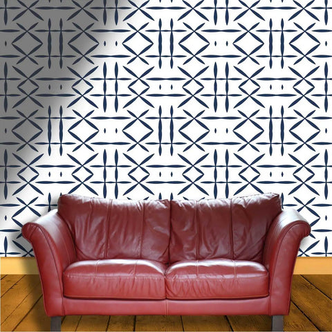 Snag This Top Tier Light Color Wallpaper Roll Boasting Thick Textured Vinyl Peel And Stick Design For Instant Room Glow Up And Chill Vibes Across Every Wall In Your Spot, featuring a geometric pattern behind a red leather couch.