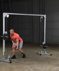 Beefy Heavy Duty Cable Crossover Machine For Home Gym Functional Trainer featuring dual high and low pulleys in use.