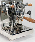 Pro Grade Dual Boiler Espresso Maker With PID Precision Tuning hardened stainless frame showcasing portafilter and steam wand.