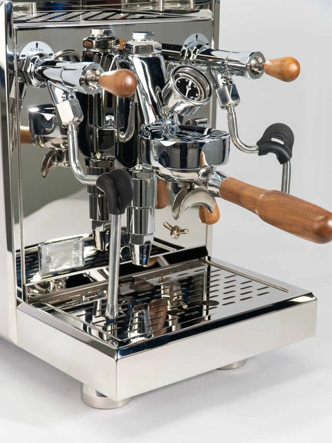 Pro Grade Dual Boiler Espresso Maker With PID Precision Tuning hardened stainless frame showcasing portafilter and steam wand.