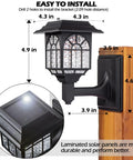 Solar Fence Lights 2 Pack Outdoor Waterproof Lanterns With Warm White LED installed on wooden post, showcasing size and solar panel.