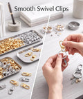 Eighty Piece Swivel Lobster Clasps In Shiny Gold And Silver Finishes shown in trays and held for keychain and craft use.