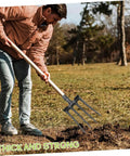 Person using Beefy Heavy Duty Four Prong Steel Pitch Fork Head for garden digging and soil loosening aeration and ground prep