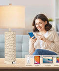 Woman using Set of 2 Farmhouse Table Lamps with 3-Way Dimmable Touch Control, Rustic Resin Nightstand Lamps with USB Ports, 26 Inch Cozy Living Room