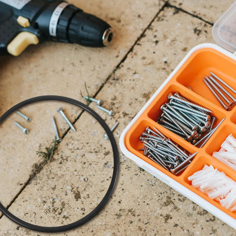 Premium Rubber Belt Replacement For Continuous Sealing Machine 2 Pack with a black rubber ring, screws, and tools on a work surface.