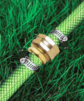 Premium One Half Inch Aluminum Hose Repair Connector Kit With Stainless Steel Clamp installed on garden hose