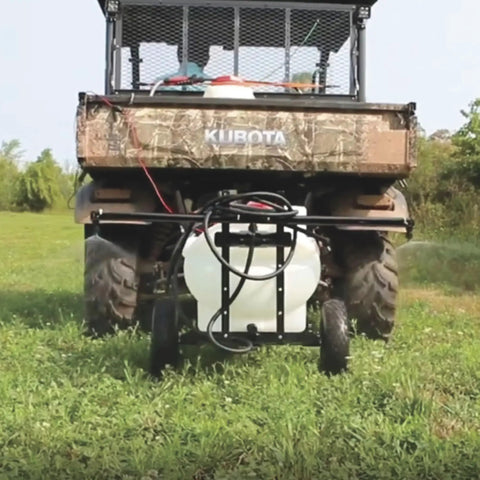 Tow Behind ATV UTV Spot Sprayer With 25 Gallon Dual Water And Concentrate Tanks, 12V Pump on grass with vehicle
