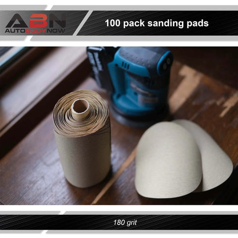 80 Grit Pro Grade Quick Change Sanding Discs Roll 6 Inch Round Aluminum Oxide Sticky Back Sandpaper With Adhesive 100 Piece Set For Drill And Sander Great For Woodworking And Metal Finishing on a wooden surface next to a power sander.
