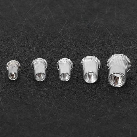 Top Shelf Rivet Nut Tool Kit With Built In Cutter And One Hundred M4 M8 Aluminum Rivnuts in assorted sizes on black background.