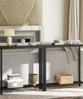 Slick Industrial Console Table For Tight Spaces, Hella Compact Two Tier Sofa Table With Open Storage Shelves, Matte Black Finish, styled behind a couch.