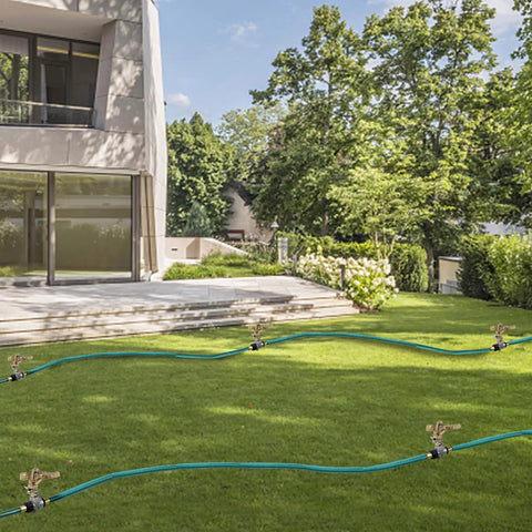 Two Pack Impact Sprinklers With Stand Spike Heavy Duty Zinc Alloy Lawn Sprinkler Heads On Spike Base in a garden setup