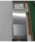 Rock Solid Compact Din Rail Power Supply For Industrial Automation And Communications Gear in packaging, metallic casing, ready for installation.