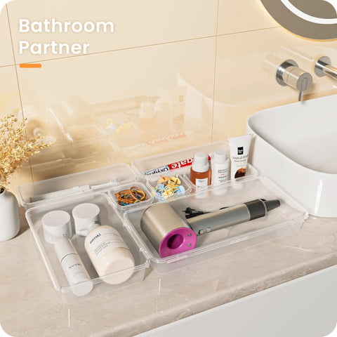 Clear Drawer Organizers Set Five Sizes Straight Up Tames Messy Vanities with cosmetics, hair tools, and accessories neatly sorted.