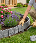 Person installing Interlocking Faux Stone Garden Edging Border Kit Easy Install Plastic Landscape Border For Yard Flower Beds And Lawn Weather-Resistant 30 Pack Included