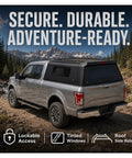 Rock Solid Truck Bed Cap For Nissan Frontier 2022 Through 2026 Fits The 5ft Short Bed Perfectly, matte black finish, showing locked tinted windows.