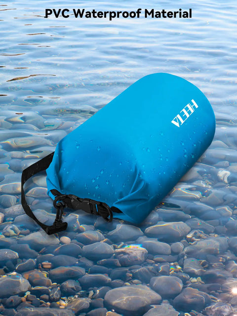 Waterproof Dry Bag Roll Top 5L Blue For Travel And Outdoor Adventures floating on water, showing PVC material and buckle.