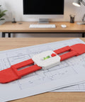 Retractable Spirit Level Tool for Air Conditioner Mounting Bracket on blueprint, measuring and leveling tool with red plastic design.