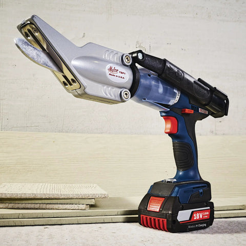 TurboShear Fiber Cement Siding Cutter attached to an 18V drill, 5/16 inch capacity, 360-degree rotating head, in action on planks