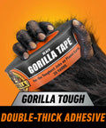 Furry hand holding Gorilla Tape 35 yards with double-thick adhesive on orange background
