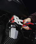 Adjustable Pliers Wrench Chrome Finish With Quick Release Button in use gripping a motorcycle part