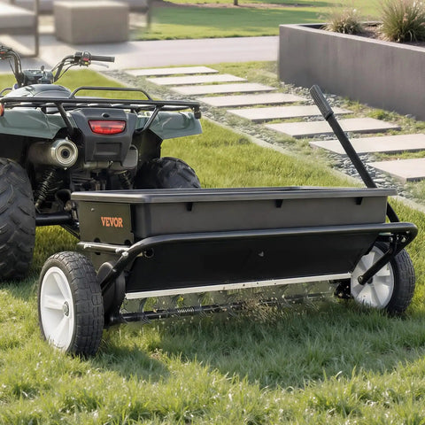 Tow Behind Lawn Spreader With Aeration Spikes For A Beefy Lawn Boost 32 Inch Wide Broadcast Spreader With 72 Aeration Tines hitched to ATV