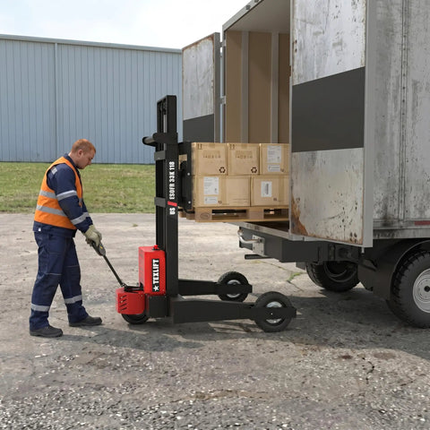 Heavy Duty Electric Pallet Stacker And Badass Off Road Workhorse That Flexes Hard Material Moves On Any Job Site And Cruises Over Uneven Ground Like A Real Champ lifting crates from a truck.