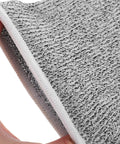 Close-up of gray HPPE material showing texture and stitching for Boss Level Cut Resistant Arm Sleeves Hppe Anti Slash Protective Guards 18 Cm Gray Work Safety Gear For Mechanics And Gardeners Four Pack That Hits Different And Stays Lock Tight.