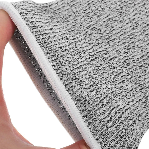 Close-up of gray HPPE material showing texture and stitching for Boss Level Cut Resistant Arm Sleeves Hppe Anti Slash Protective Guards 18 Cm Gray Work Safety Gear For Mechanics And Gardeners Four Pack That Hits Different And Stays Lock Tight.