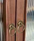 Solid Brass Cabinet Ring Pulls Six Pack Antique Circle Drawer Pulls installed on wooden cabinet with vintage design