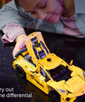 Child assembling Chevrolet Corvette Stingray Muscle Car Building Kit For Kids And Up Teens A Display Ready Model Car Toy Set With Realistic Details And Easy Start Guide Kid Friendly Awesome Build Gift For Birthdays And Collectors