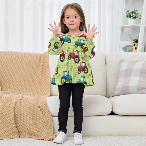 Ultra Soft Cotton Baby Girl Blouse With Ruffled Sleeves Featuring Farm Tractor Print On Green Background For Everyday, Holidays And School, Cozy Long Sleeve Top, Machine Washable, Easy Care 5T worn by a girl indoors.