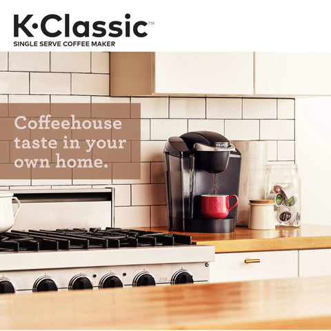 K Classic Single Serve Coffee Maker For K Cup Pods Black Finish With Removable Drip Tray on kitchen counter next to stove