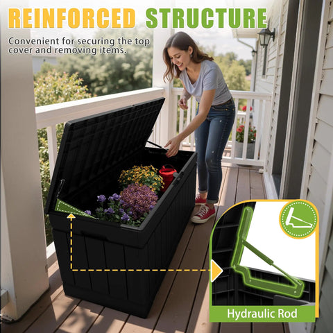 Woman opening 82 Gallon Outdoor Storage Box With Lid For Patio Backyard Gear Garden Tools Pool Supplies Waterproof UV Resistant Lockable Weatherproof Storage Bin Black, showing hydraulic rod and potted plants inside.