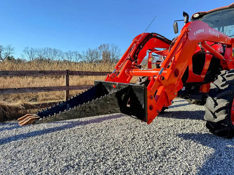 Stump Bucket For Tractors And Skid Steers Up To 105 HP With Bi Directional Ripping Edge attached to orange tractor, gravel path
