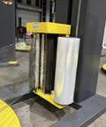 Straight Shots Automatic Shrink Wrap Machine Built Tough For Heavy Duty Pallet Wrapping And Seamless End Of Line Automation That Cuts Through The Daily Grind With Zero Hassle showing wrap roll holder and film dispensation system.