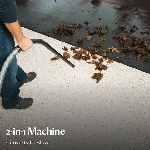 Person using Garage Pro Wall Mounted Wet Dry Vacuum And Blower With 12 Amp Power blowing leaves on driveway