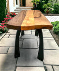 Industrial Metal Bench Legs 16 Inch Height Set Of 2 supporting a wooden table outdoors