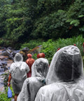 Emergency Disposable Rain Ponchos With Drawstring Hood For Adults Family Pack Clear 10 Pack on people hiking in forest