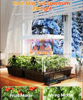 Indoor setup of Full Spectrum LED Grow Light Seed Starter Kit with 80 cell tray, heating mat and adjustable dome.