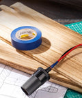 PVC Electrical Insulating Tape Roll Built To Last With Strong Adhesion And Abrasion Resistance on desk with wiring and plans