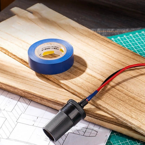 PVC Electrical Insulating Tape Roll Built To Last With Strong Adhesion And Abrasion Resistance on desk with wiring and plans