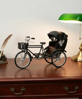 Vintage Metal Tricycle Model With Heavy Duty Aluminum Alloy Build And Old School Three Wheel Rickshaw Design on a wooden desk