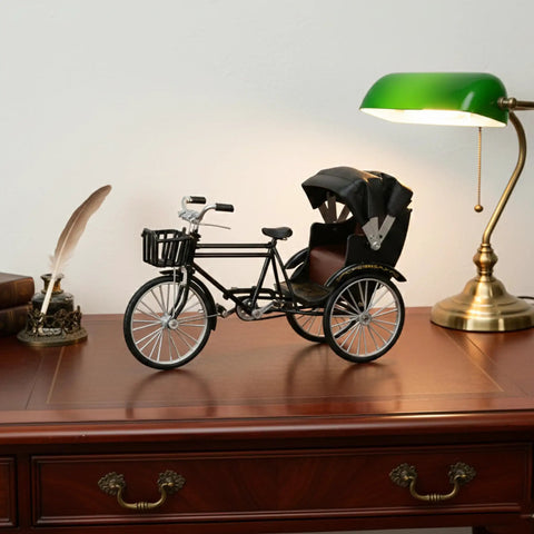 Vintage Metal Tricycle Model With Heavy Duty Aluminum Alloy Build And Old School Three Wheel Rickshaw Design on a wooden desk