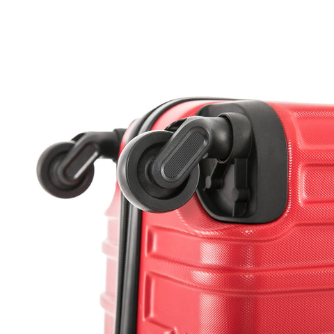 Red InUSA VASTY hardside carry-on luggage with black spinner wheels; close-up of corner.