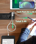 Person using 16.5 Foot Long Power Strip With Flat Plug Seven Wide Spaced Outlets And Three USB Ports Surge Protector on desk