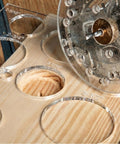 A Damn Sharp Transparent Acrylic Router Template For Woodworking Boasts Thirteen Circle Sizes packed on a wood surface with visible circle sizes.